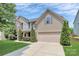 Charming two-story home with a two-car garage, lush landscaping, and manicured lawn at 1427 Rosemont Dr, Indian Land, SC 29707
