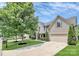Traditional two-story home with landscaped front yard and long driveway leading to attached garage at 1427 Rosemont Dr, Indian Land, SC 29707