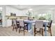 Open-concept kitchen with white cabinetry, a kitchen island with barstool seating, and modern appliances at 1427 Rosemont Dr, Indian Land, SC 29707