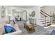 Cozy living room featuring a sofa, stylish decor, and an open view to the dining area at 1427 Rosemont Dr, Indian Land, SC 29707
