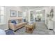 Cozy living room with neutral colors, a sofa with blue pillows, and an adjoining dining area at 1427 Rosemont Dr, Indian Land, SC 29707