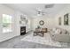 Cozy living room with a fireplace, neutral tones, and a large rug creating a warm and inviting atmosphere at 1427 Rosemont Dr, Indian Land, SC 29707