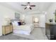 Main bedroom reveals a stylish en suite bathroom through an open doorway at 1427 Rosemont Dr, Indian Land, SC 29707