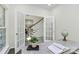 Bright home office featuring french doors, a desk, and natural light at 1427 Rosemont Dr, Indian Land, SC 29707