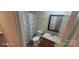 Bathroom featuring a vanity, toilet, shower with a patterned curtain, and a framed mirror at 165 Brantley Place Dr, Mooresville, NC 28117