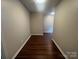 Clean hallway with modern wood-look flooring and neutral walls at 165 Brantley Place Dr, Mooresville, NC 28117