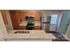 Well-equipped kitchen with stainless steel appliances, granite countertops and wood cabinets at 165 Brantley Place Dr, Mooresville, NC 28117
