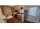 Well-equipped kitchen with stainless steel appliances, granite countertops and wood cabinets at 165 Brantley Place Dr, Mooresville, NC 28117