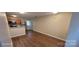 Open-concept living area featuring sleek wood-look floors at 165 Brantley Place Dr, Mooresville, NC 28117