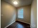 Small, well-lit room with modern wood-look flooring and neutral walls at 165 Brantley Place Dr, Mooresville, NC 28117