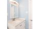 A full bathroom features a light blue wall, vanity with a mirror and bright lighting at 1655 Woodhaven Rd, Rock Hill, SC 29732