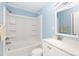 A full bathroom with blue walls, a shower-tub, and a vanity with a sink and mirror at 1655 Woodhaven Rd, Rock Hill, SC 29732