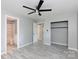 A bedroom features a fan, closet and an ensuite bathroom at 1655 Woodhaven Rd, Rock Hill, SC 29732