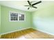 A bright bedroom with a ceiling fan and natural light at 1655 Woodhaven Rd, Rock Hill, SC 29732
