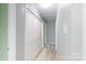 Hallway with closet space and grey walls and tile flooring at 1655 Woodhaven Rd, Rock Hill, SC 29732