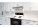 White kitchen featuring matching cabinetry, countertops and black electric range at 1655 Woodhaven Rd, Rock Hill, SC 29732