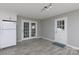 Bright kitchen with white cabinetry and easy access to backyard via glass panel doors at 1655 Woodhaven Rd, Rock Hill, SC 29732