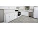 Modern kitchen featuring white cabinets, stainless steel appliances, and subway tile backsplash at 1655 Woodhaven Rd, Rock Hill, SC 29732
