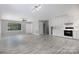 Open-concept living area with modern tile flooring and updated white kitchen appliances at 1655 Woodhaven Rd, Rock Hill, SC 29732