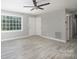 Bright living room featuring gray walls, tile flooring and large window at 1655 Woodhaven Rd, Rock Hill, SC 29732