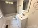 Stylish bathroom with tiled shower and tub, modern vanity, and updated fixtures at 179 Duval Nw St, Concord, NC 28025