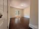 Well-lit bedroom featuring hardwood floors, a large window, and neutral paint tones at 179 Duval Nw St, Concord, NC 28025