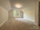Well-lit bedroom featuring neutral carpet and two windows at 179 Duval Nw St, Concord, NC 28025
