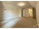 Spacious bedroom with neutral carpet and fresh paint at 179 Duval Nw St, Concord, NC 28025