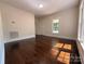 Bright room with hardwood floors, neutral paint, base trim and abundant natural light at 179 Duval Nw St, Concord, NC 28025