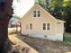 Side view of home featuring a white painted foundation and many windows at 179 Duval Nw St, Concord, NC 28025