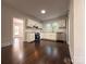 Bright kitchen boasts stainless appliances, white cabinets, subway tile backsplash, and hardwood floors at 179 Duval Nw St, Concord, NC 28025