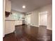Charming kitchen featuring stainless appliances, white cabinets and subway tile, with sliding door to adjoining room at 179 Duval Nw St, Concord, NC 28025