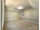 Neutral loft area with carpeting, ample lighting, and fresh paint at 179 Duval Nw St, Concord, NC 28025
