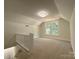 Spacious loft with neutral carpet and ample windows with natural light at 179 Duval Nw St, Concord, NC 28025