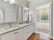 Bathroom with double sinks, granite countertops, white cabinets, and a view of the bathtub at 1842 Caroline Way, Fort Mill, SC 29715