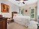 Cozy bedroom featuring a comfortable bed, soft carpet, and natural light from two windows, creating a serene retreat at 1842 Caroline Way, Fort Mill, SC 29715