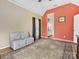 Bedroom featuring a high ceiling, an accent wall, and a view into the ensuite bathroom at 1842 Caroline Way, Fort Mill, SC 29715