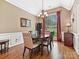 Inviting dining room with wood floors, crown molding, and large window with natural light at 1842 Caroline Way, Fort Mill, SC 29715