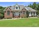 Charming brick home with manicured lawn and lovely landscaping at 1842 Caroline Way, Fort Mill, SC 29715