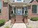 Close up of brick steps leading to the front door and portico at 1842 Caroline Way, Fort Mill, SC 29715