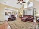 Open-concept living room with a high ceiling and views into the kitchen at 1842 Caroline Way, Fort Mill, SC 29715