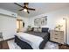 Cozy bedroom features a ceiling fan, rug, and stylish wall decorations creating a relaxing retreat at 2620 Park Rd # F, Charlotte, NC 28209