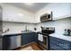 Functional kitchen with stainless steel appliances and efficient layout at 2620 Park Rd # F, Charlotte, NC 28209