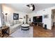 Inviting living room with a comfortable sofa and large TV at 2620 Park Rd # F, Charlotte, NC 28209