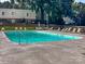Large in-ground community pool with surrounding lounge chairs offers a refreshing oasis at 2620 Park Rd # F, Charlotte, NC 28209