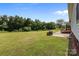 Large backyard with mature trees and a grill at 307 Nc Hwy 49 S Hwy, Richfield, NC 28137