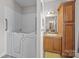 Bathroom featuring walk-in jacuzzi tub, vanity with framed mirror and sink at 307 Nc Hwy 49 S Hwy, Richfield, NC 28137
