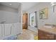 Bathroom with walk-in jacuzzi tub, vanity with sink, and linen storage at 307 Nc Hwy 49 S Hwy, Richfield, NC 28137