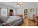 Bright bedroom with hardwood floors, ceiling fan, and large windows allowing for natural light at 307 Nc Hwy 49 S Hwy, Richfield, NC 28137