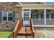 Entrance to home with stairs leading up to front door and covered porch at 307 Nc Hwy 49 S Hwy, Richfield, NC 28137